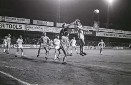 Mike Saxby has the ball taken off his head