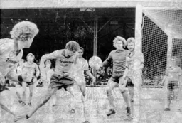 Mike Saxby nods the ball out for a corner