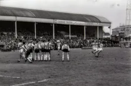 David Moss lifts a free kick over the wall