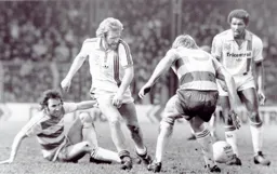 Tony Grealish slips the ball through