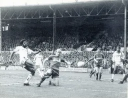 Ricky Hill shoots wide, watched by former Hatter Paul Futcher