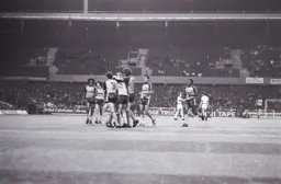 Mark Aizelwood gets the congratulations of his teammates on scoring the opening Town goal