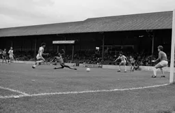 Ricky Hill slides in the second goal