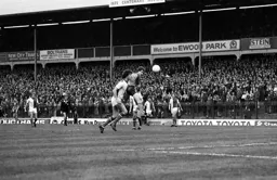 Steve White heads for goal