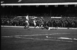 Steve White tries to round the keeper