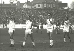 Players applaud the travelling fans