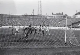 Watford defence watches as a free kick goes wide