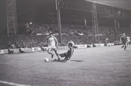 David Moss rounds the defender