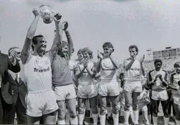 Brian Horton lifts the trophy