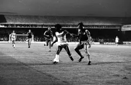 Ricky Hill shadowed by Alvin Martin