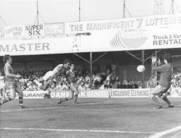 David Moss scores the third goal with a diving header