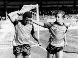 Paul Walsh congratulates Brian Stein after his goal levels the score at 2-2