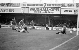 Ricky Hill heads the ball under the keeper