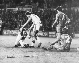 Frank Bunn picks Billy Kellock off the floor after Kellock`s second goal