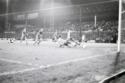 Frank Bunn slides in his goal