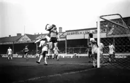 Mal Donaghy gets his head to the ball in the box