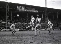 Mal Donaghy gets in a header on goal