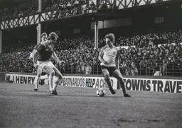 Paul Walsh gets past the Everton defender