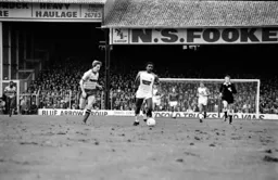 Ricky Hill moves past Watford’s Kenny Jackett