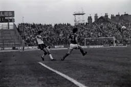 David Moss crosses into the box