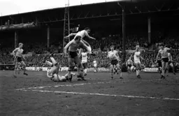 Paul Elliott gets his head to the ball