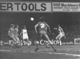 Mal Donaghy watches as David Moss tries a shot at goal