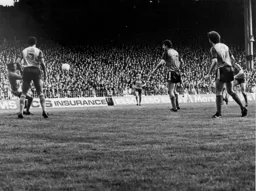 Raddy Antic (hidden behind Mal Donaghy) fires home the goal