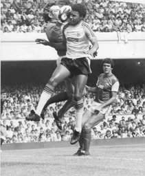 Pat Jennings gets his hands on the ball to deny Paul Elliott