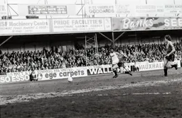 Ricky Hill in a race for the ball