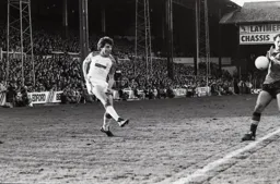 Mal Donaghy crosses into a defender