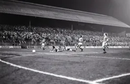 Brian Stein on the floor watches his effort find the net