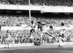 Trevor Aylott in an ariel duel with Danny Thomas