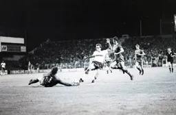 Steve Elliott tries to take the ball past the keeper