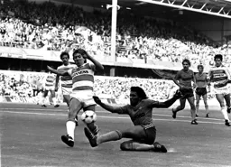 Ricky Hill gets to the ball first