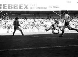 The ball leaves the boot of Steve Elliott for the winner