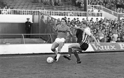 Steve Elliott gets to the ball first