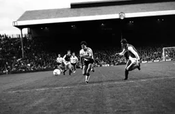 Frankie Bunn goes past Tony Adams