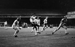 Mick Harford crashes in a shot