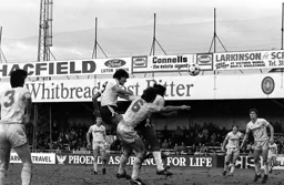 Mick Harford heads for goal