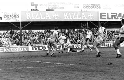 Ricky Hill still gets a shot away as he falls to the floor