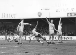 Brian Stein wheels await in delight as he puts the Town ahead while the Spurs defence appeal for a non existant offside