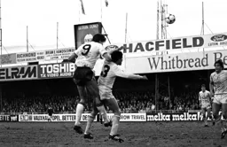 Mick Harford as usual above the defender