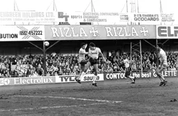 Mick Harford heads for goal