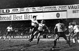 Mick Harford heads for goal