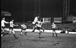 Mick Harford clashes with the Watford defender