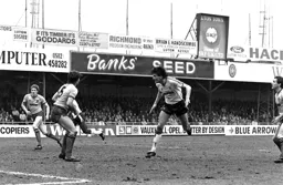 Mick Harford heads for goal