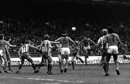 Mick Harford heads for goal