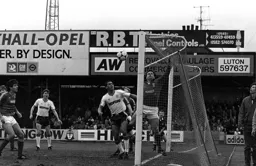 Brian Stein watches keeper Paul Cooper tip the ball over