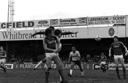 Mick Harford thunders the ball into the net