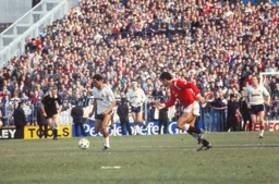 Brian Stein drives the Town forward to the relief of Foster and Nicholas